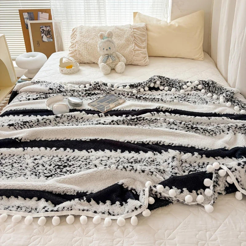 Dual tone tussle throw blanket